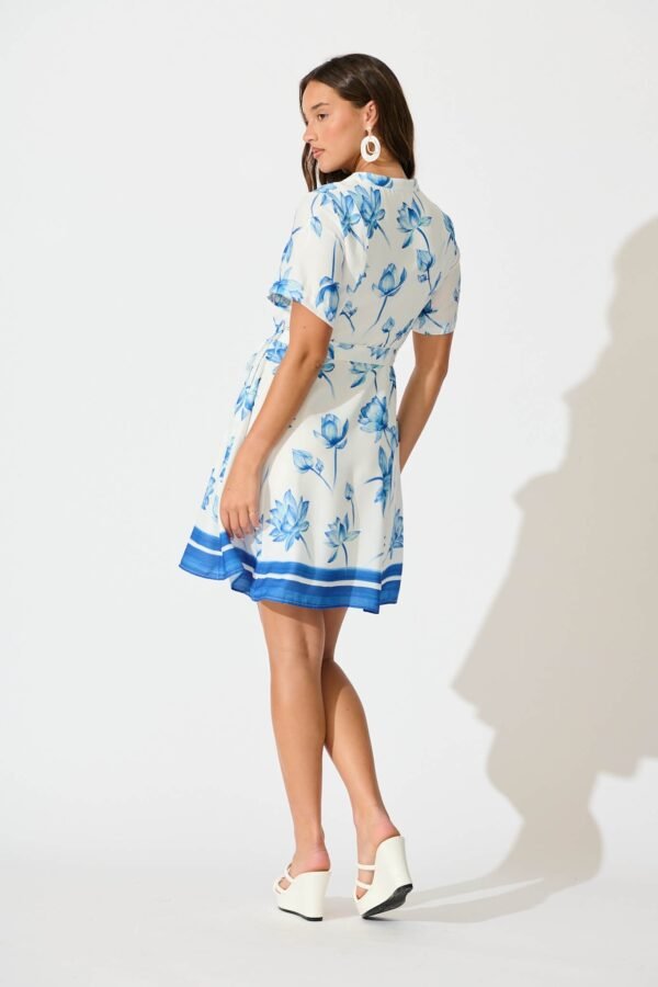 241114_StFrock_Milly_PM_30240407-1-WHT-BLU-FLO_0197.jpg Dress in White with Blue Flower Border Linen Blend